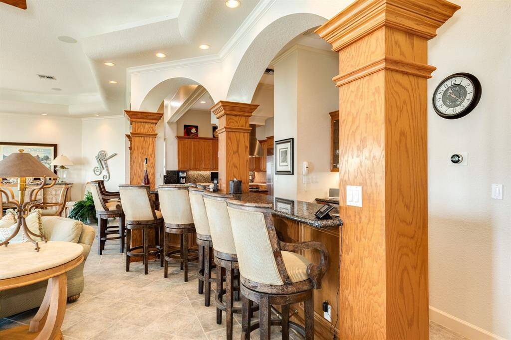 Wonderful serving bar with full wet bar located behind and of course the kitchen just beyond.
