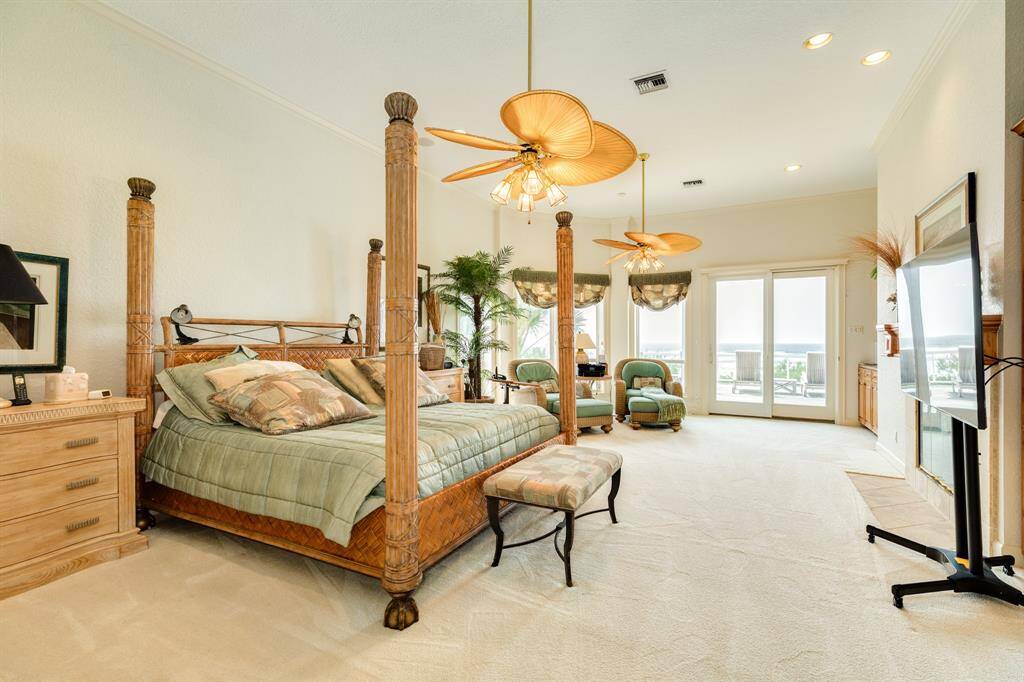 Primary bedroom, just off of the living area is spacious and designed for comfort.