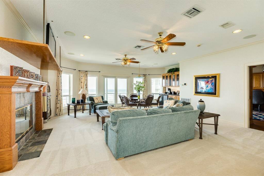 On the second level of the home, you will find a spacious family/game room complete with a wet bar & fireplace.