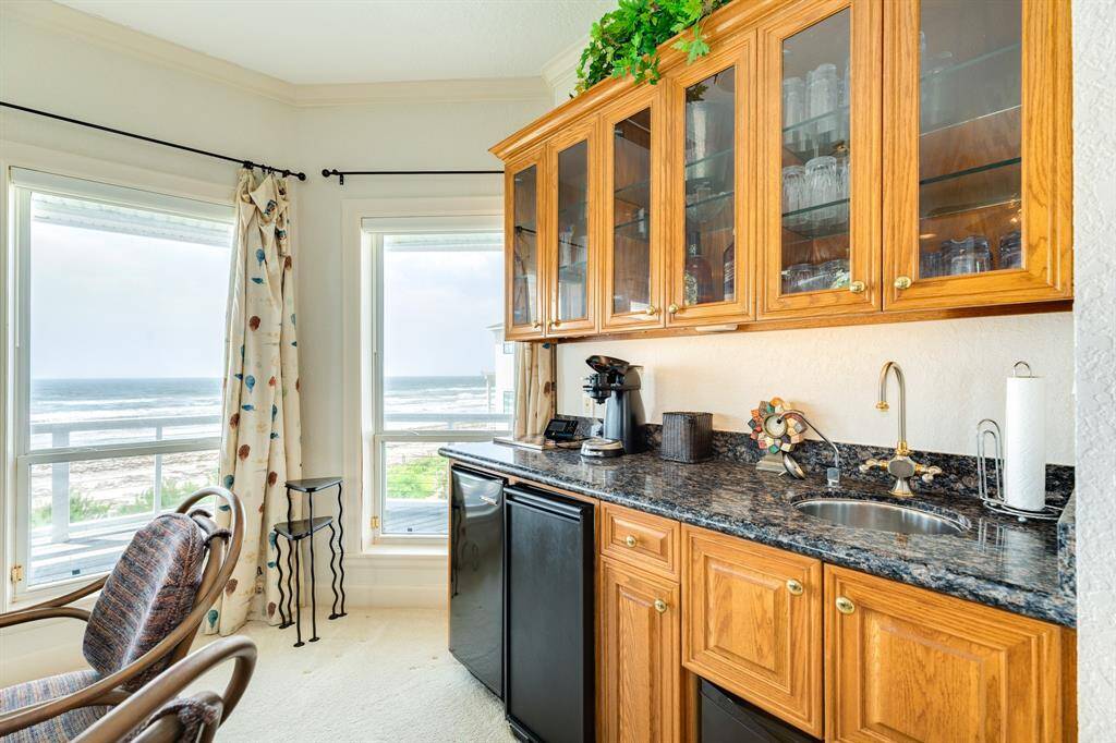 The wet bar includes an ice machine, small refrigerator, dishwasher. Ideal for coffee service or beverage of choice.