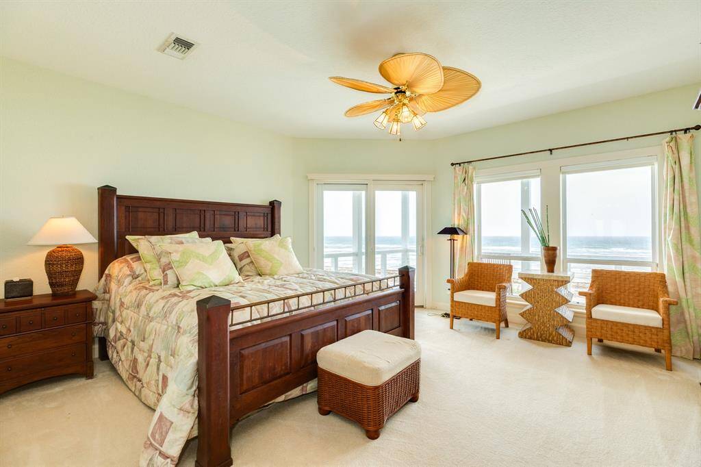 2nd bedroom upstairs in the SE corner of the home. There is an ensuite bath, fireplace and of course deck access from this bedroom.