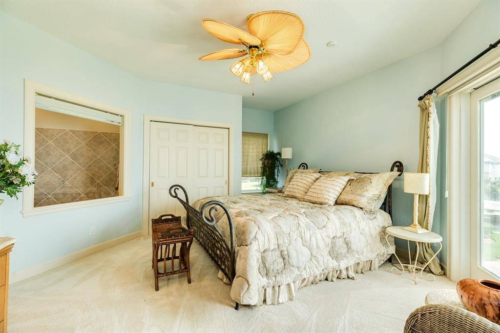 Bedroom #3 in the NE corner of the home. This bedroom also has an ensuite bath with a soaking tub & small deck access.
