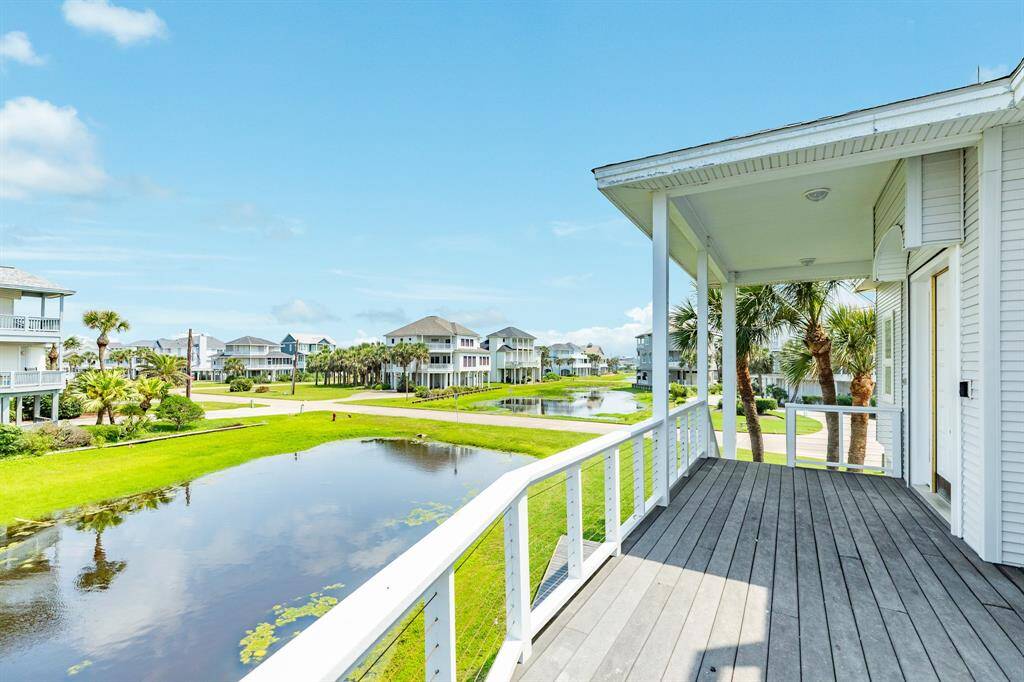 Front entrance landing view of the home. View is down the Pirates Beach West "lagoon" which runs the width of the subdivision.
