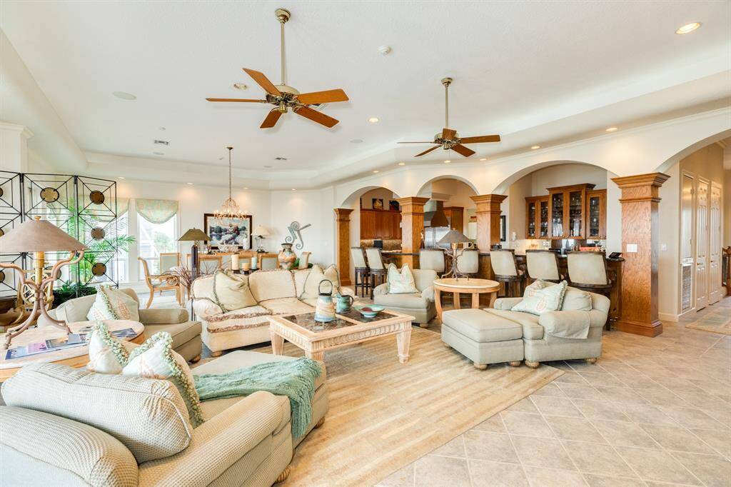 Living area is spacious and open to the serving counter & kitchen beyond.