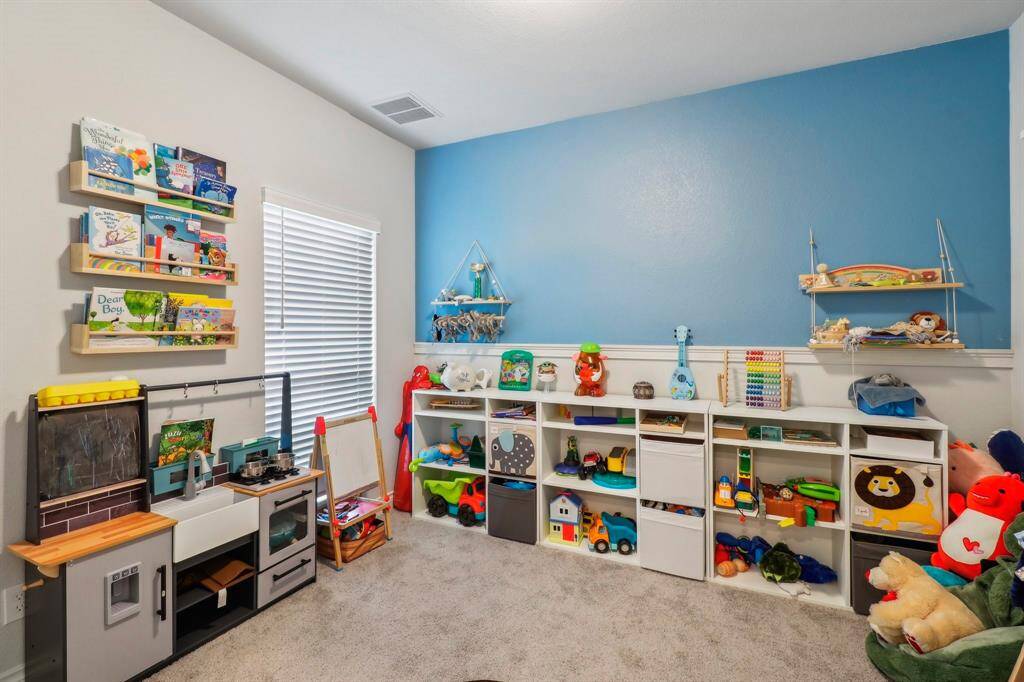 Bedroom 2 downstairs, now used as game room