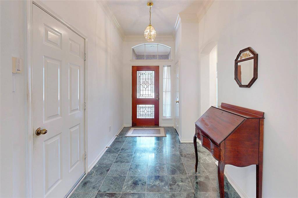 Pretty front door!  Entry to the right is the front bedroom and bathroom.  The door on the left is the garage