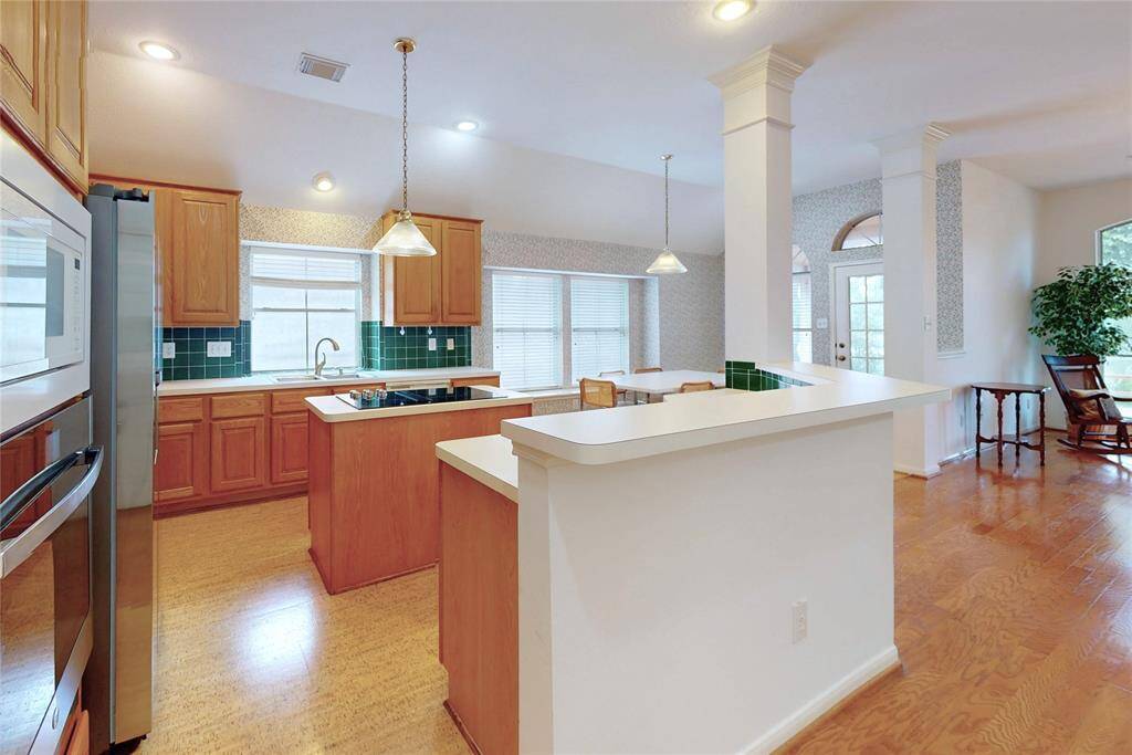Nice open kitchen looking toward family room and breakfast area