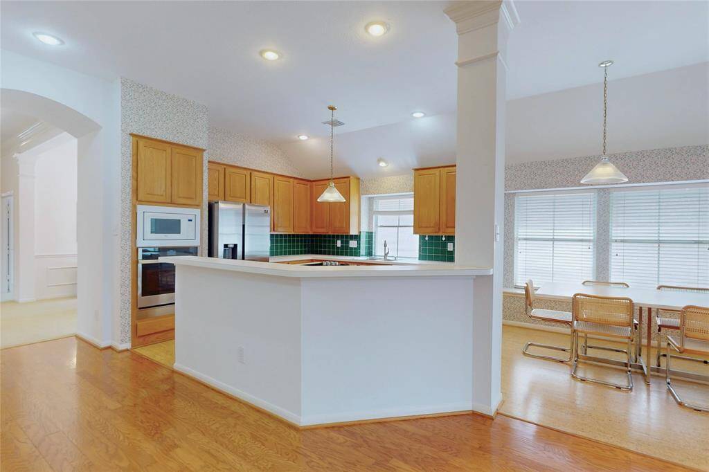 Another view of the kitchen and breakfast room
