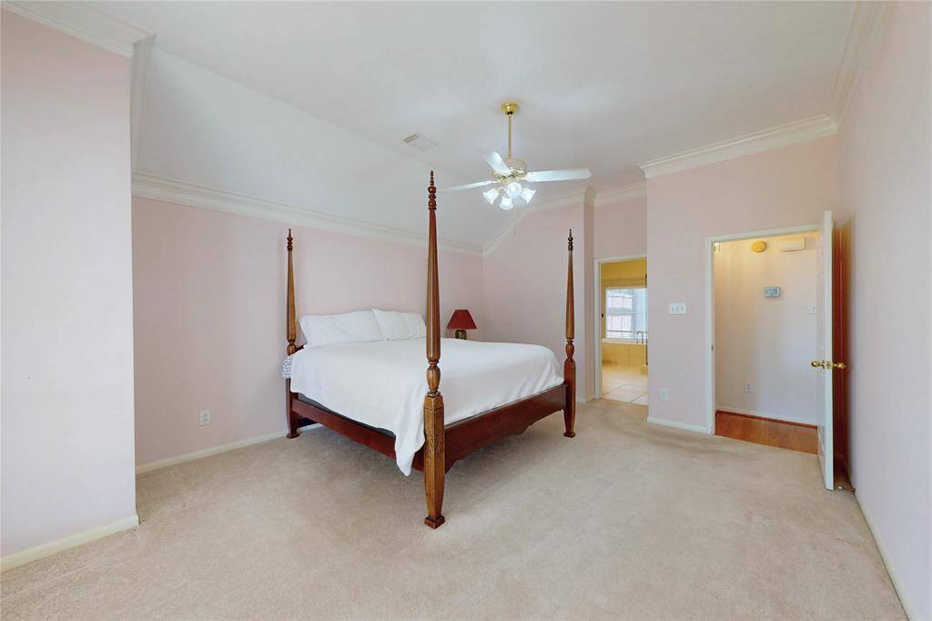 Primary bedroom looking toward primary bath