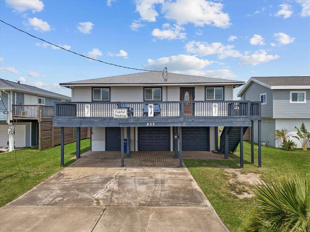 Waterfront property featuring a boat dock with a covered lift, surrounded by neighboring homes with elevated decks. Ideal for boating enthusiasts seeking direct water access and a relaxed, community-oriented lifestyle.