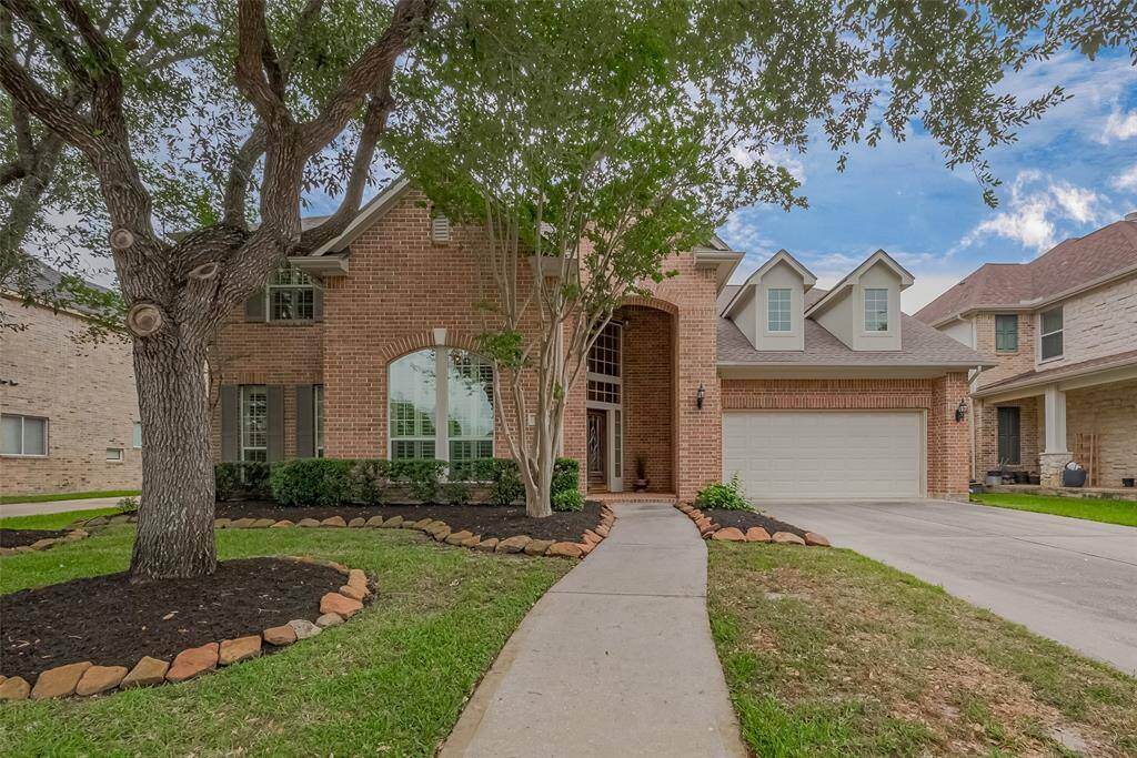 Welcome to 5726 Ballina Canyon, the beautiful home boasts a grand entrance with lush landscaping and a charming front porch with gated entrance community.