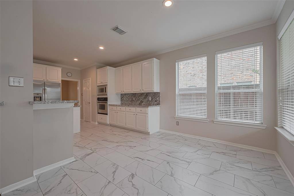 Open breakfast area gives accessibility and convenience make it a desirable feature in this home.