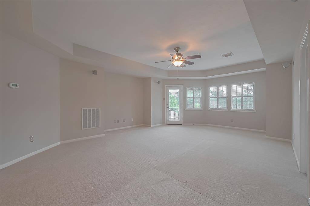 Family room connects to the upstairs terrace. Great place to be outside enjoying sunsets or the backyard and the bayou views.
