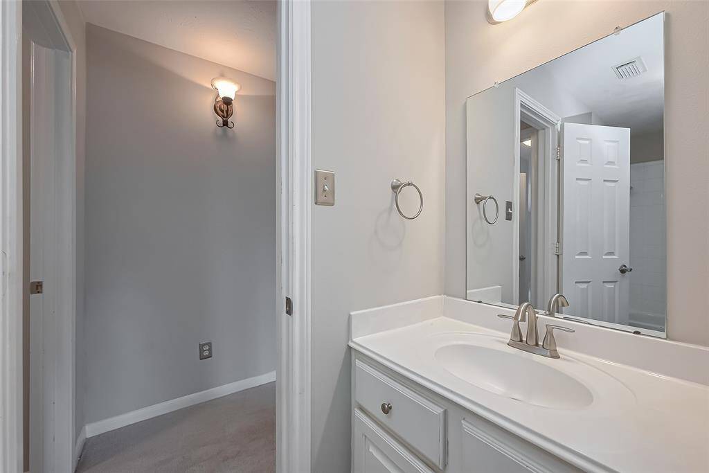 Jack and Jill bathroom with shower tub combo.