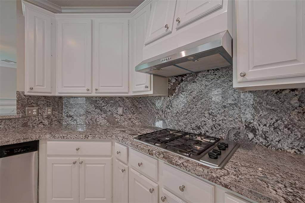 The kitchen with ample cabinetry and pantry.