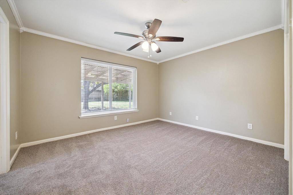 Primary bedroom with view to backyard