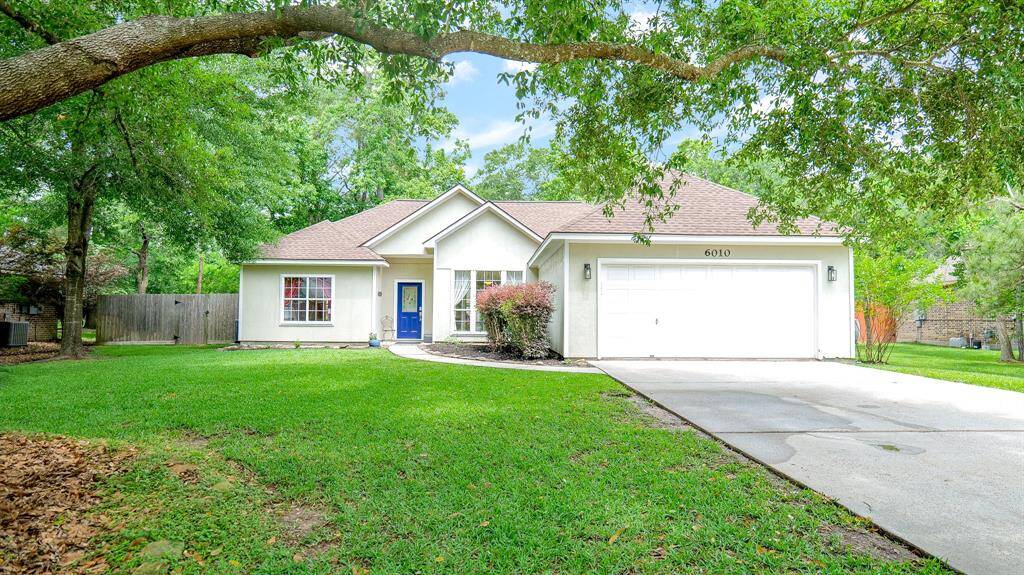 ADORABLE ONE STORY HOME NESTLED ON ALMOST HALF AN ACRE IN MAGNOLIA