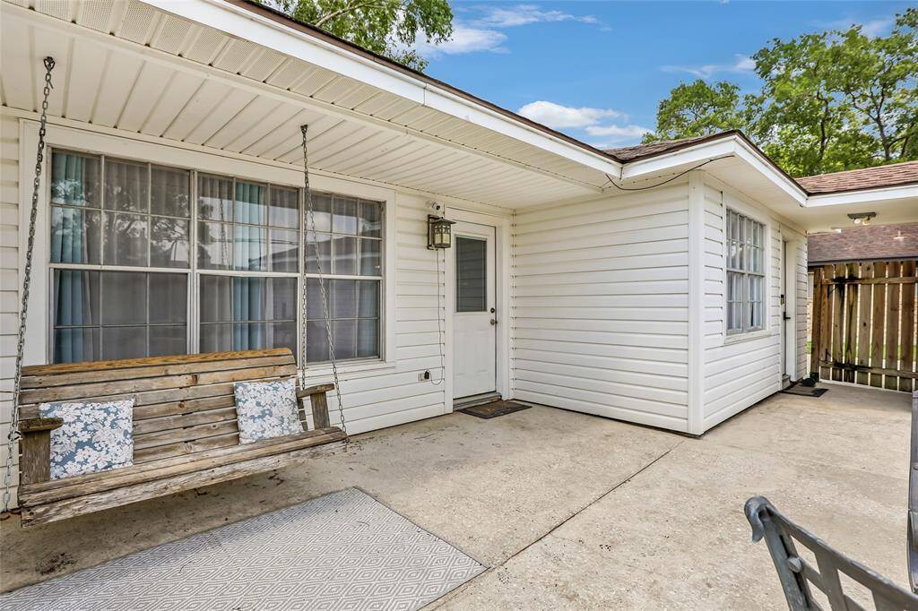 Back  yard with covered porch swing