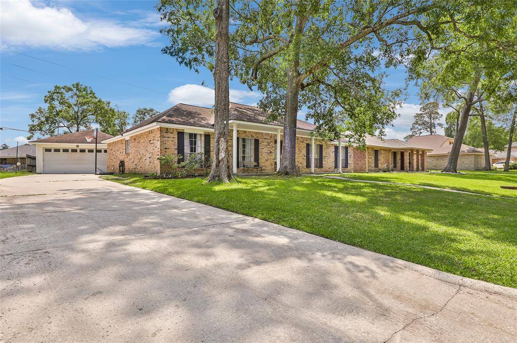 Long driveway with detached garage