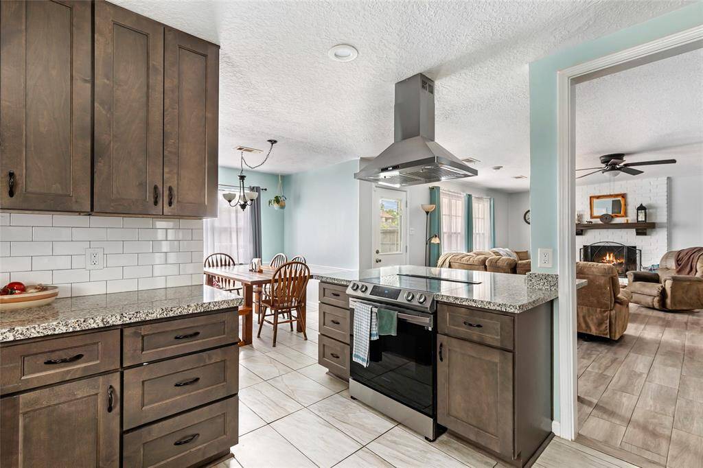 Remodeled kitchen open to living room and dining area