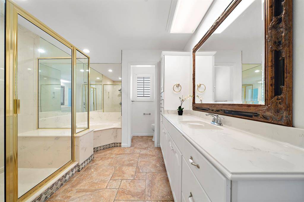 En suite bathroom with a shower and tub