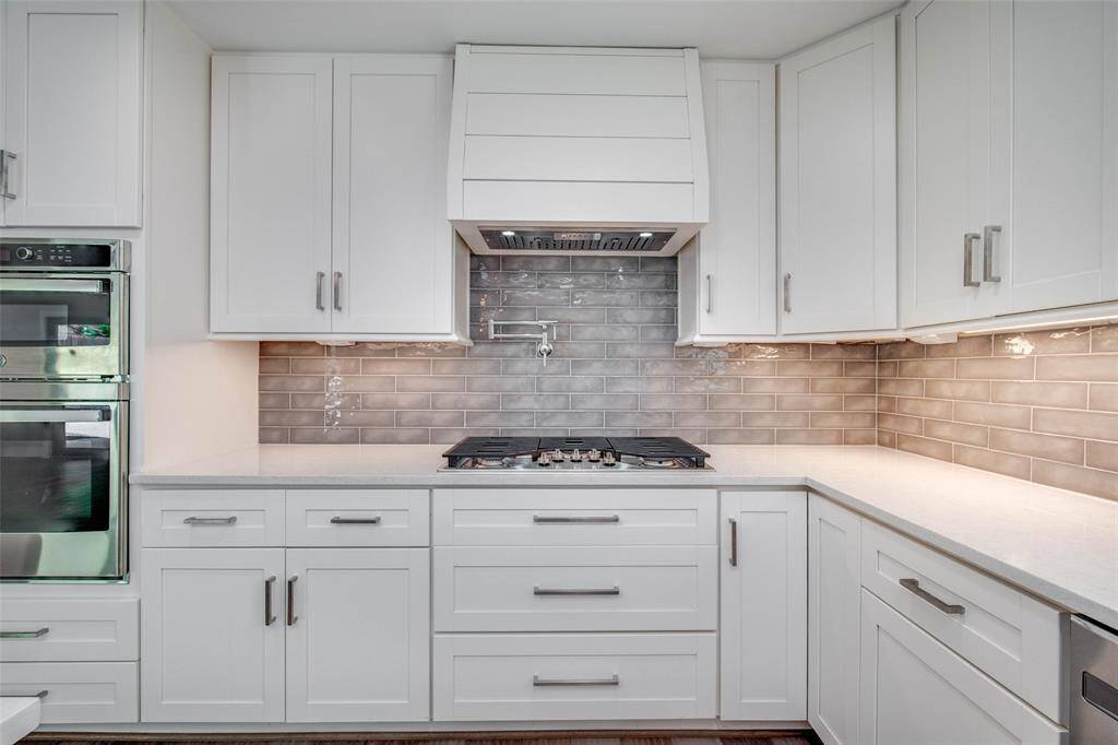 Custom all-wood Shaker style cabinets.