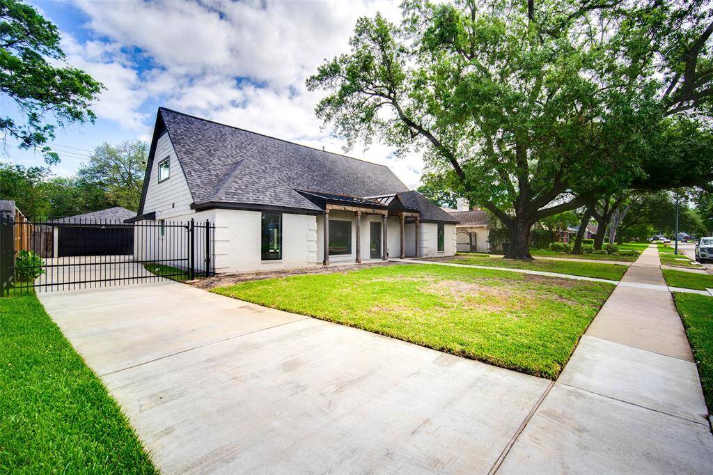 Ample driveway with gate. Concrete was replaced.