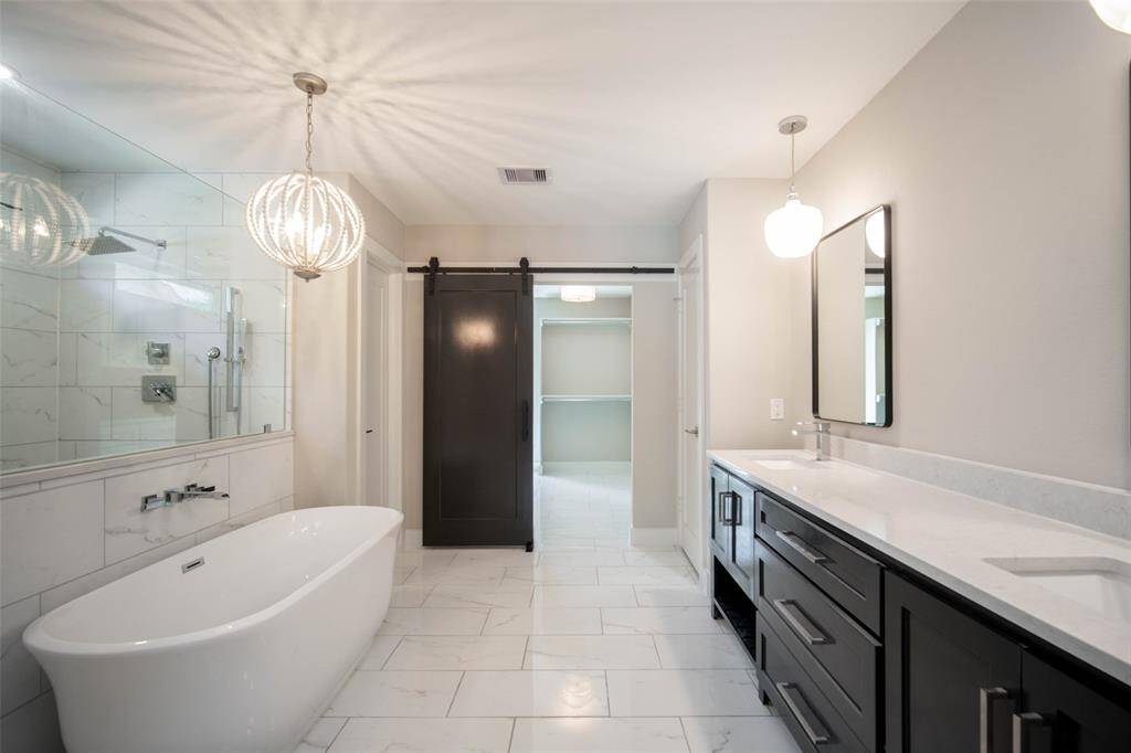Luxurious spa-like primary bathroom.