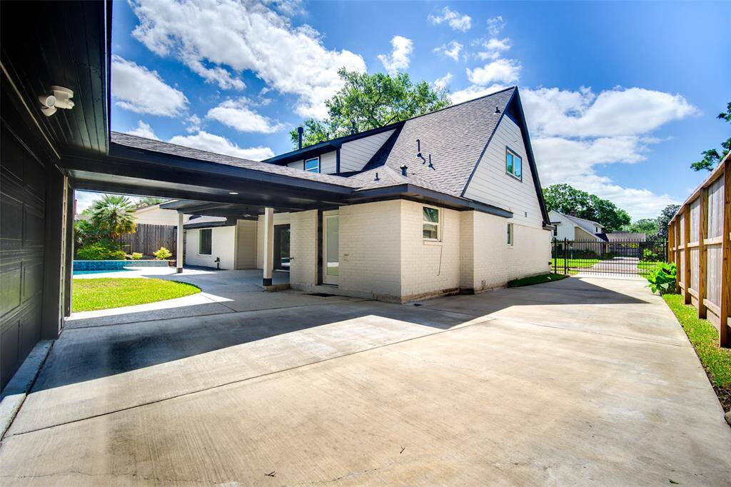 The covered breezeway connects the home to the garage.