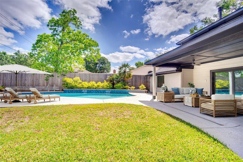 Virtually staged photo.  Plenty of grass space for kids & pets to play.