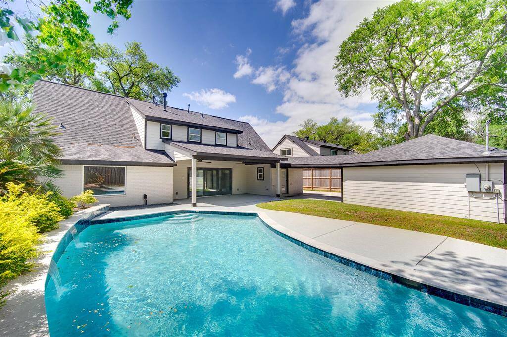 Remodeled pool includes recent plumbing, quartz plaster, travertine coping, ceramic waterline tile, drains, skimmer and new pump.