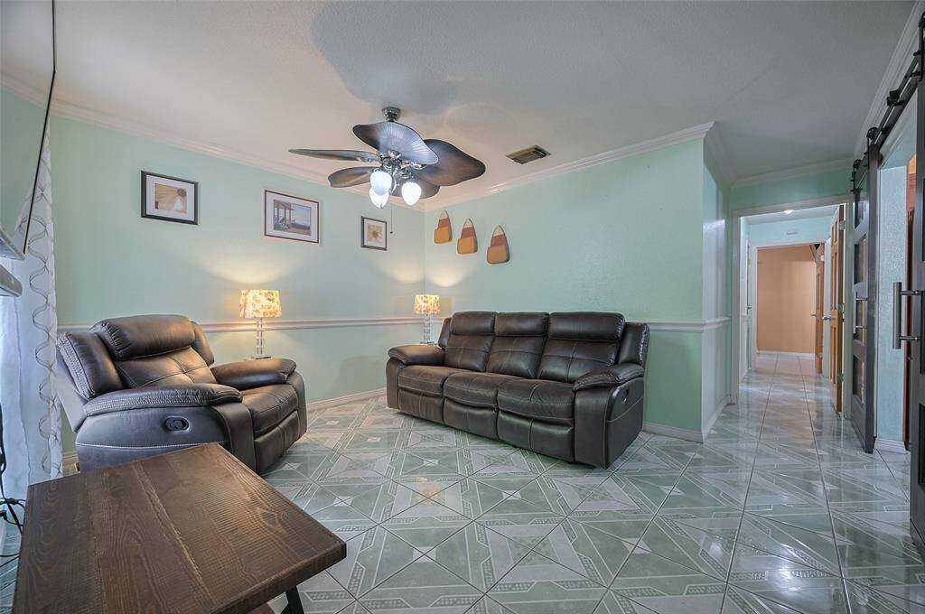 The cozy and inviting living room measures 13'8" x 11'6", offering a comfortable space to relax or gather. Though the home is a manageable 996 sq ft, it’s thoughtfully designed with a good flow and impressive storage. A perfect choice for first-time buyers or those looking to downsize with ease.