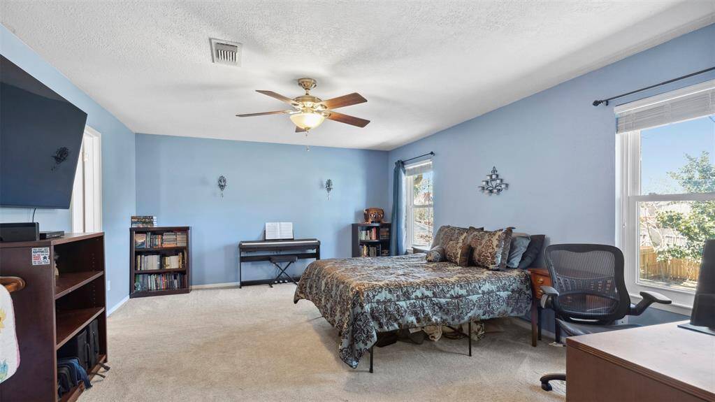 This spacious master bedroom is your retreat, complete with ample space, a serene atmosphere, and large windows that bring in beautiful light. It’s the perfect place to unwind after a long day.