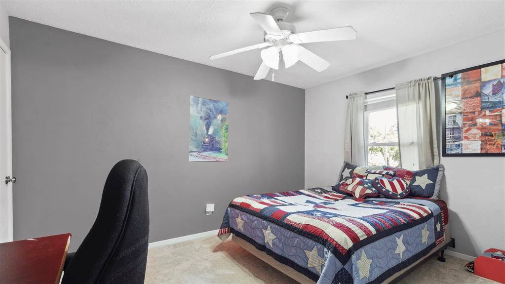 The remaining three bedrooms are generously sized, offering plenty of room for family, guests, or a home office. A well-appointed full bath is conveniently located nearby.