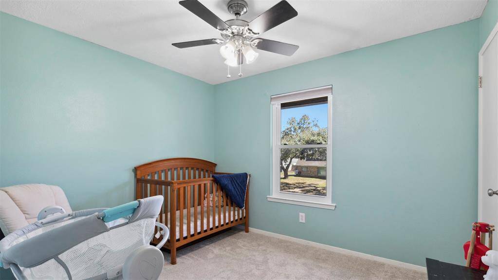 The remaining three bedrooms are generously sized, offering plenty of room for family, guests, or a home office. A well-appointed full bath is conveniently located nearby.