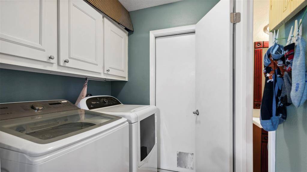 Convenient and spacious laundry room with plenty of storage space. Perfect for all your laundry needs, featuring washer and dryer hookups and room to organize. A practical and functional space that keeps your home tidy and organized.