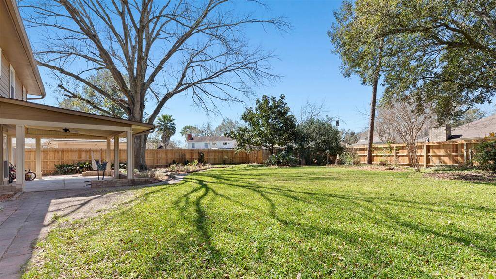 Step outside to your private covered patio, an ideal spot for outdoor dining, lounging, or entertaining. The expansive yard provides endless possibilities for gardening, play, or even adding a pool. It’s a true outdoor oasis.