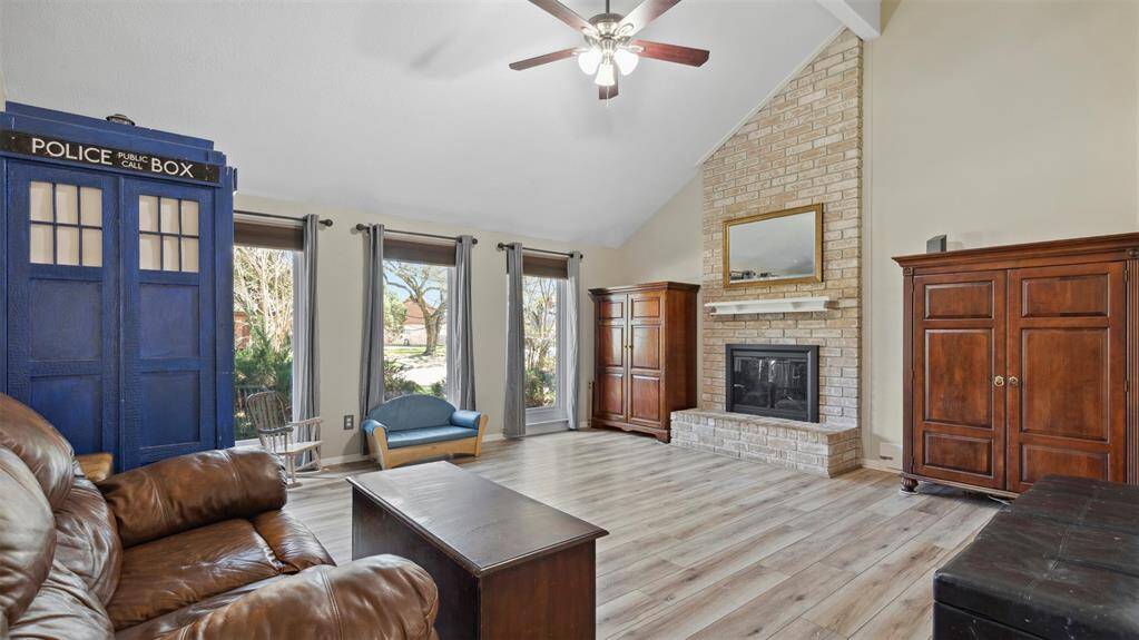 Welcome to this stunning living area featuring soaring high ceilings that create an open, airy atmosphere. Perfect for both relaxation and entertaining, the space is flooded with natural light, highlighting the spacious layout and elegant finishes.