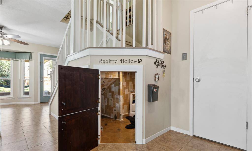 A whimsical Harry Potter-style nook tucked beneath the staircase! This cozy spot offers endless possibilities — whether it's a secret reading space or a playful hideaway for kids or pets, it’s sure to spark imagination.