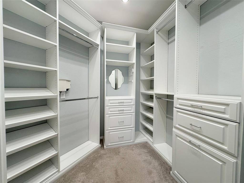 Custom Shelves & Racks in the Walk-in Closet