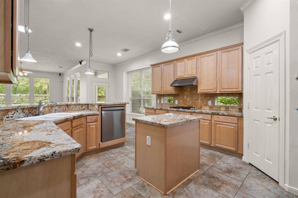 Updated kitchen has stainless appliances, granite counters, updated gas stove, and more!