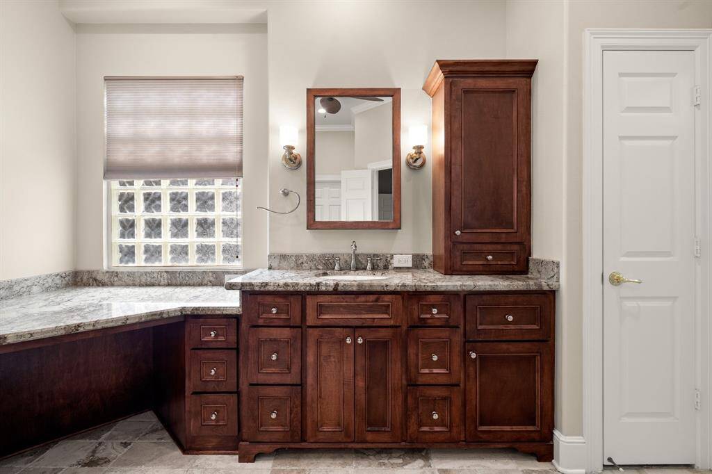 Vanity area gets natural light, next to the custom counters to the right.
