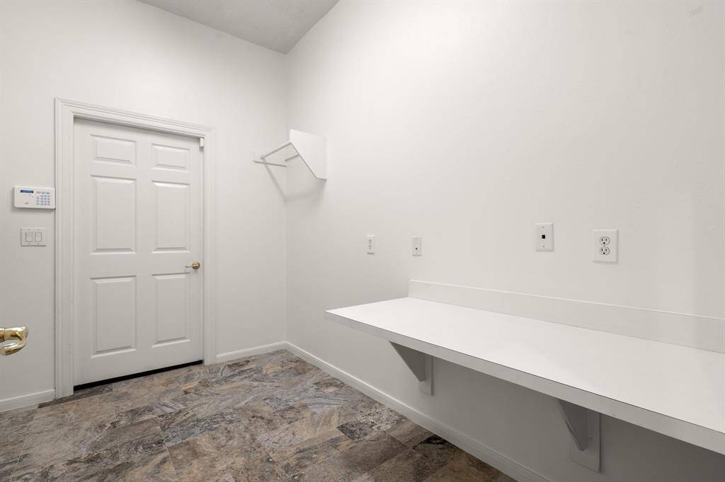The laundry is inside and has a workspace, too.