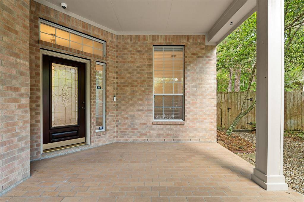 A large, inviting front porch with added pavers!