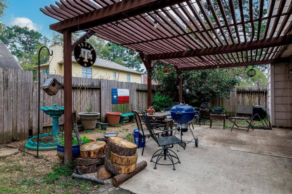 Backyard area with big pergola.
