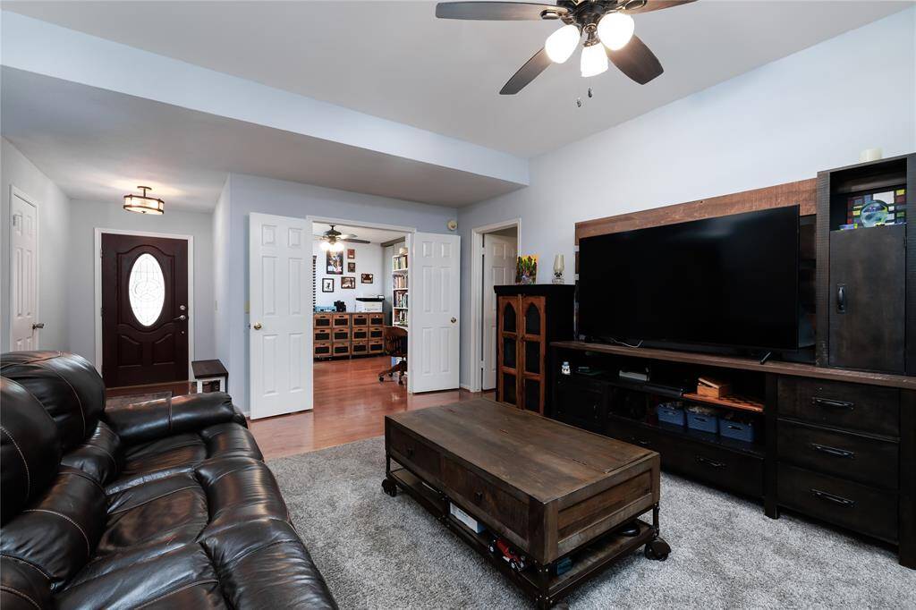Main living area looking towards front entrance/foyer of the home.