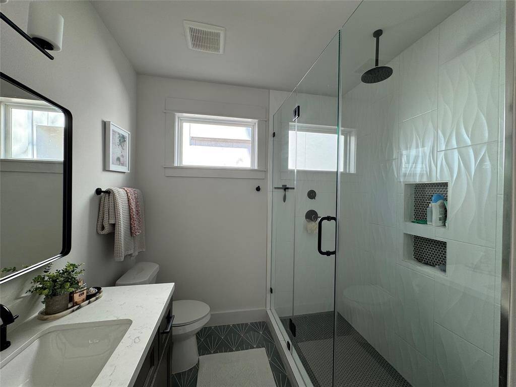 Custom walk-in shower with rain shower