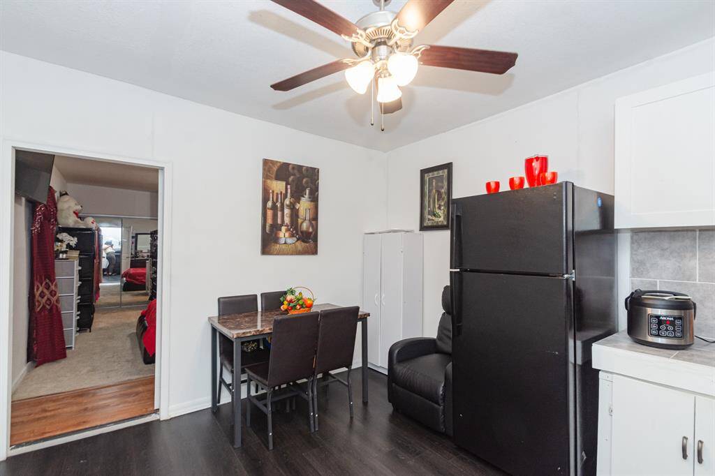 Another view of the entrance/kitchen/dining area.