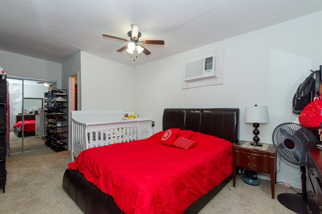 A large bedroom with closet and full bath.  The unit is a/c and heat.
