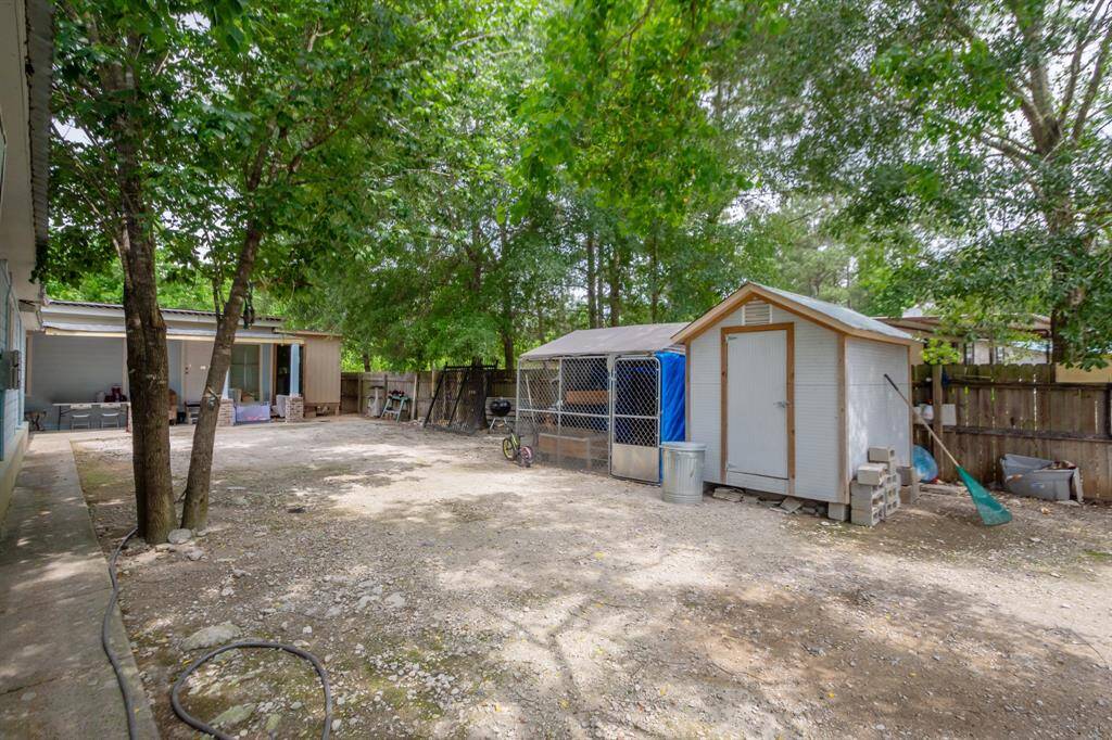 Plenty of shade and you could put up a carport or swing set, chicken coop and your own storage building.